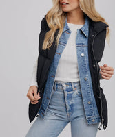 black + denim puffer vest