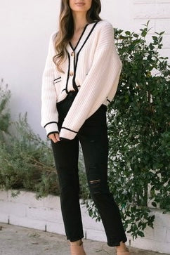 white with black trim button up sweater